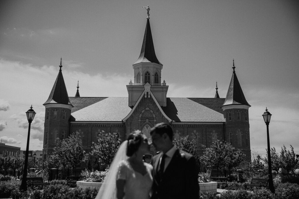 Provo Wedding Photographer takes a photo in front of the Provo City Center Temple