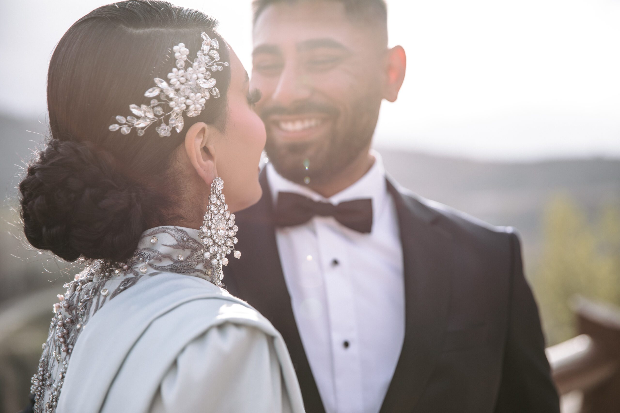 A couple smiles during photos during their Stein Eriksen Lodge Wedding